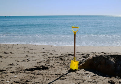 Scenic view of beach against clear sky