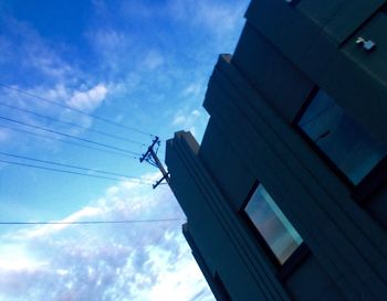 Low angle view of building against blue sky