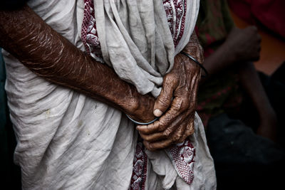 Close-up of man holding hands