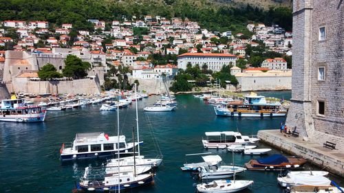 High angle view of boats moored at harbor