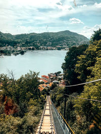 High angle view of railroad tracks by mountain against sky