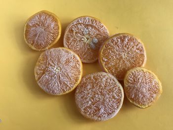 High angle view of  frozen sliced oranges on table