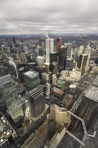 High angle view of modern buildings in city against sky