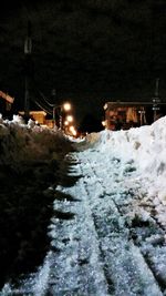 Snow covered street at night