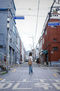 Rear view of man walking on street