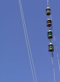 Low angle view of vapor trail against clear blue sky