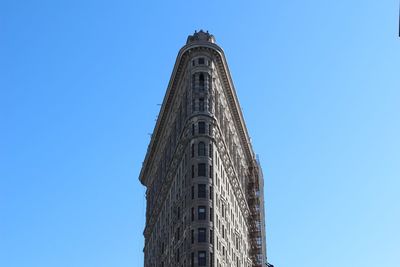 Low angle view of building against blue sky