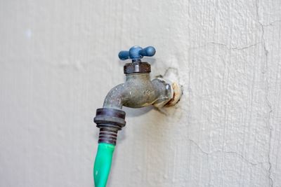 Close-up of faucet on wall