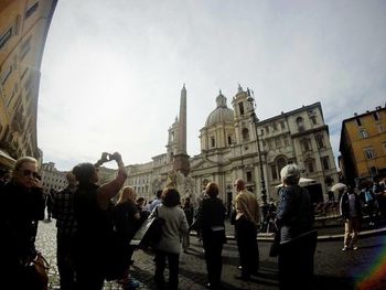 Tourists in front of building