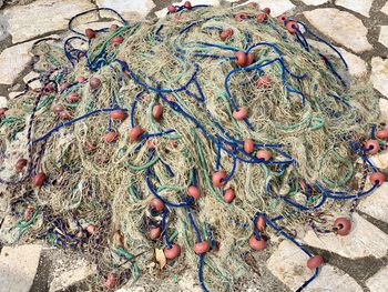High angle view of fishing net on land
