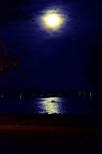 Scenic view of lake against sky at night