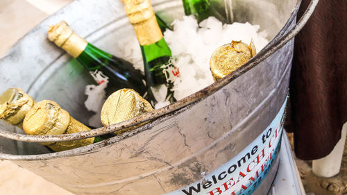 Close-up of beer bottles in ice bucket