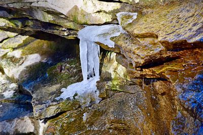 Close-up of rock formation in water