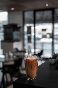 Close-up of coffee served on table at cafe