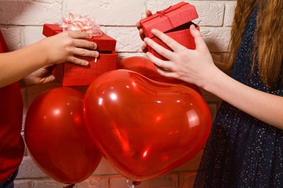 Children give each other gifts for valentine's day