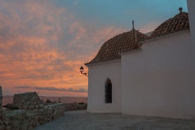 Entrance of historic building against sky during sunset