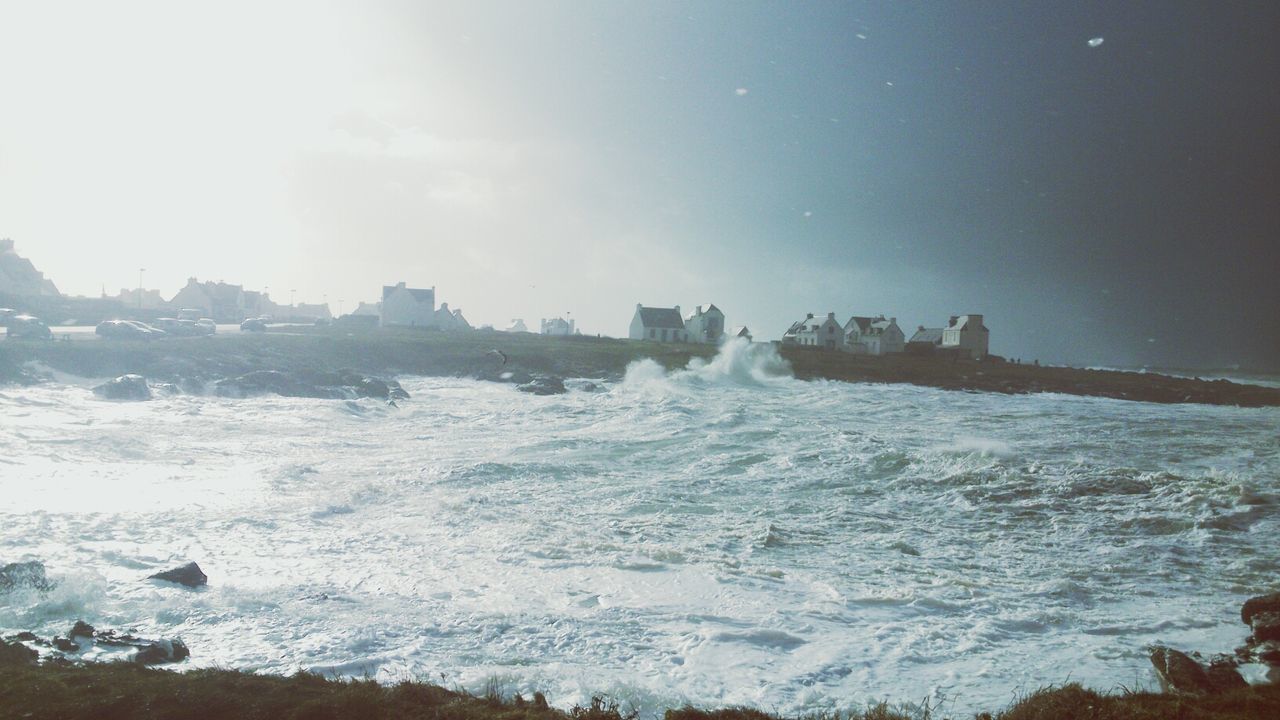 water, sea, surf, wave, scenics, beauty in nature, nature, cold temperature, winter, snow, motion, splashing, sky, tranquil scene, tranquility, beach, power in nature, shore, frozen, rock - object