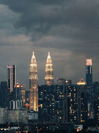 City skyline against sky at dusk