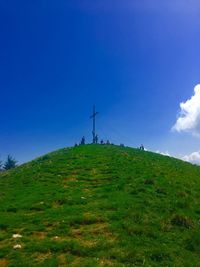 Low angle view of mountain against blue sky