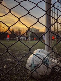 Cityscape seen through chainlink fence