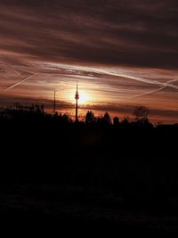 Silhouette landscape against sky during sunset