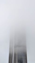 Low angle view of modern buildings against sky in city