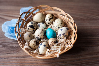 High angle view of eggs in basket on table