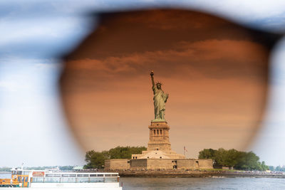 Statue of liberty against sky during sunset