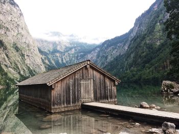 Built structure by lake against sky