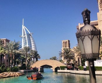 Built structures against clear blue sky