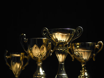 Close-up of wine glass against black background