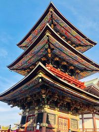 Low angle view of temple building against sky