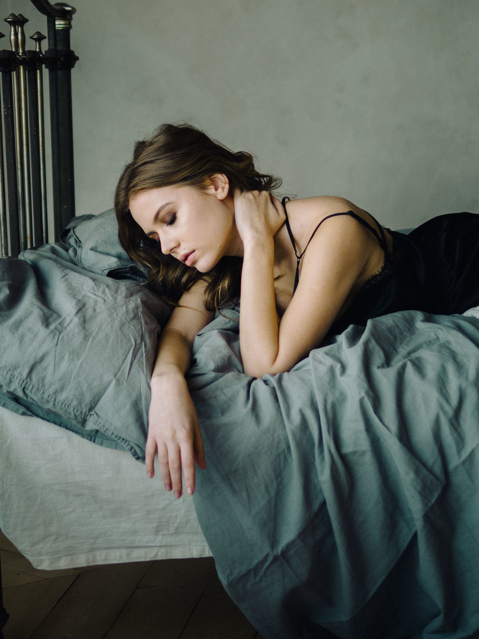 furniture, bed, one person, indoors, young adult, lying down, young women, real people, home interior, relaxation, domestic room, women, lifestyles, bedroom, beautiful woman, leisure activity, adult, hairstyle, contemplation