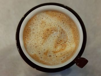 High angle view of cappuccino on table