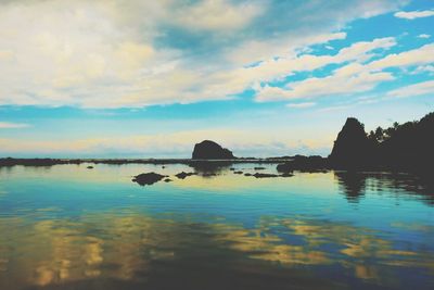 Scenic view of sea against sky at sunset