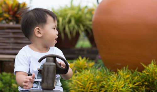 Cute boy looking away in playground