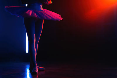 Low section of woman standing on stage