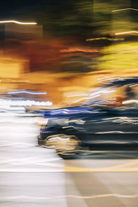 Uk, england, london, blurred motion of driving taxi and surrounding traffic at night