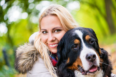 Portrait of young woman with dog