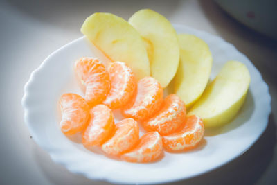 High angle view of orange slices in plate on table