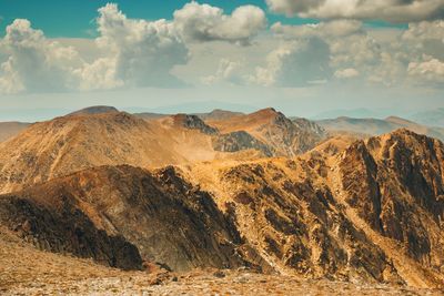 Scenic view of arid landscape against sky