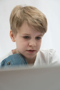 Portrait of cute boy with mobile phone