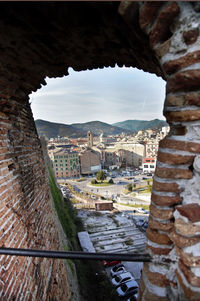 Cityscape seen through arch