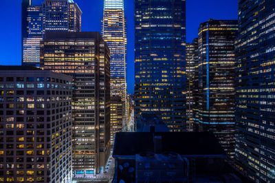 Illuminated buildings in city at night