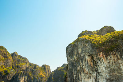 Low angle view of rock formation against sky