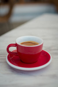 Close-up of coffee cup on table