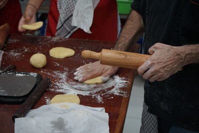 Midsection of man preparing food