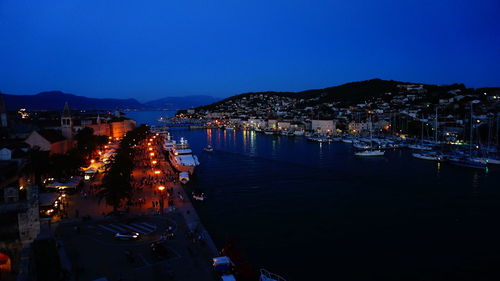 View of illuminated cityscape against clear sky