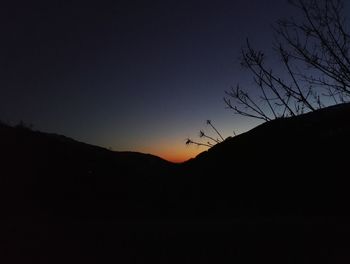 Silhouette mountain against sky during sunset