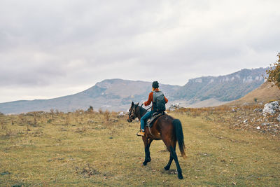 Horses riding horse